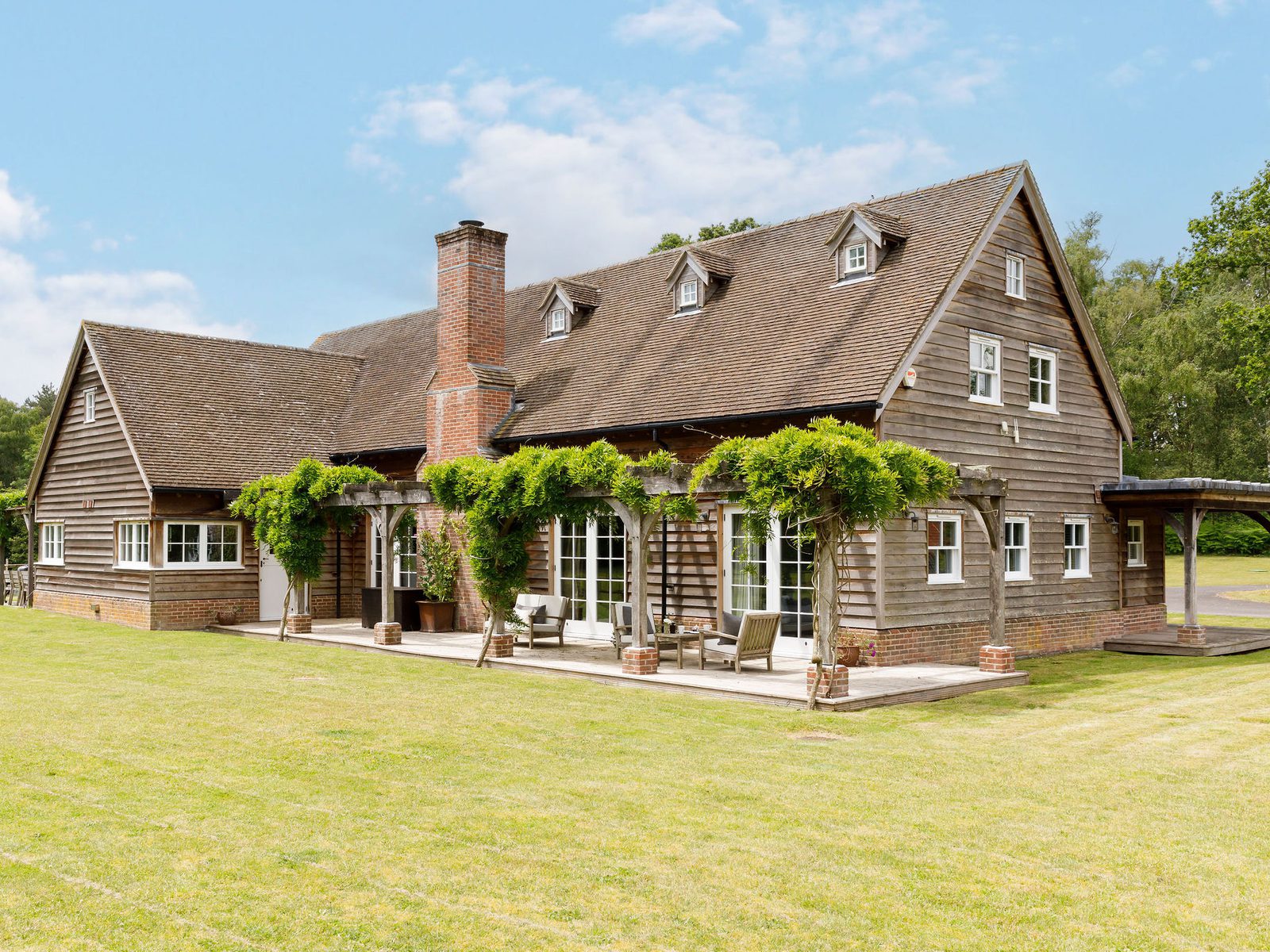 Greenoaks West Sussex garden with barn view