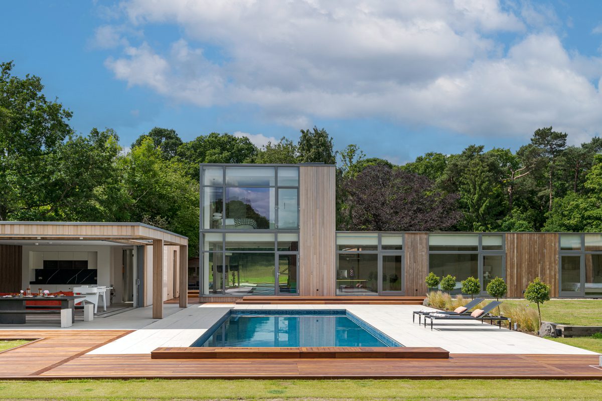 Swimming pool and modern facade at Marama Luxury Home