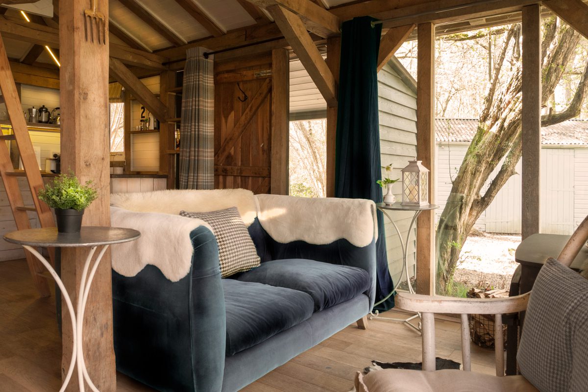 The Cabin West Sussex snug living area with sofa